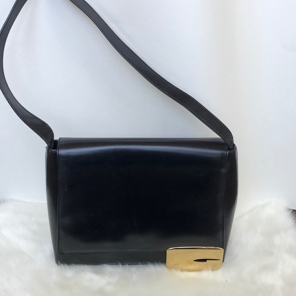 Gucci Handbags - Vintage Gucci black purse with gold G accent